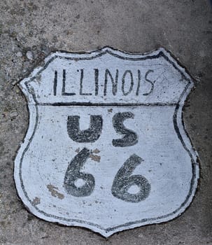 Route 66 sign painted on the road in Illinois.