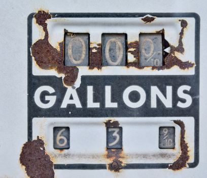 Old rusty american gas pump panel, displaying the price in dollars and filling amount in gallons