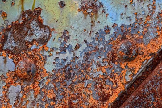 Old rusted iron sheet with rivets