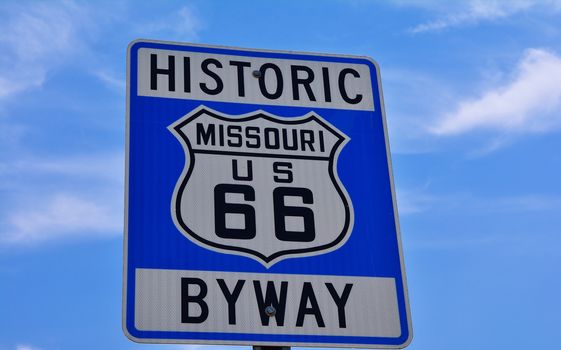 Historic route 66 highway sign in Missouri USA. Blue sky background
