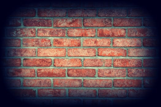 Red brick wall texture background with vignetting corners
