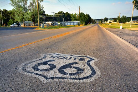 U.S. Route 66 highway, with sign on asphalt on Missouri.