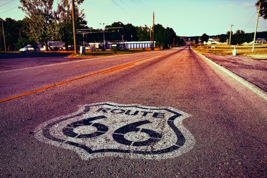 U.S. Route 66 highway, with sign on asphalt on Missouri.
