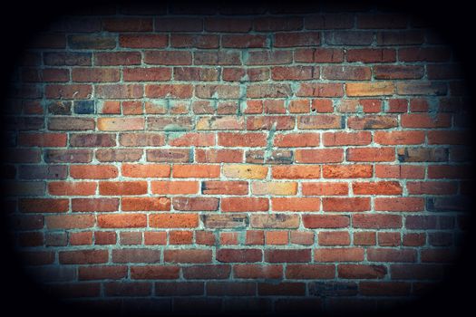 Red brick wall texture background with vignetting corners