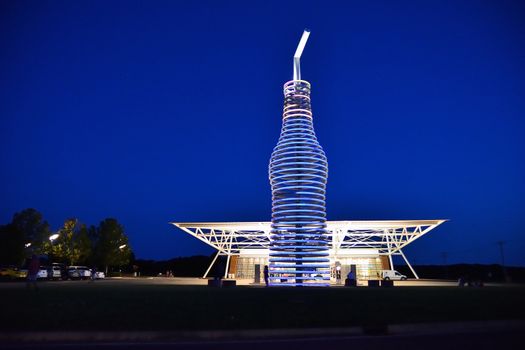 Arcadia, Oklahoma - July 19, 2017: Drive down historic route 66 through Arcadia, Oklahoma, and you canÕt miss the neon, 66-foot-tall soda bottle in front of POPS. The biggest bottle of soda in the world