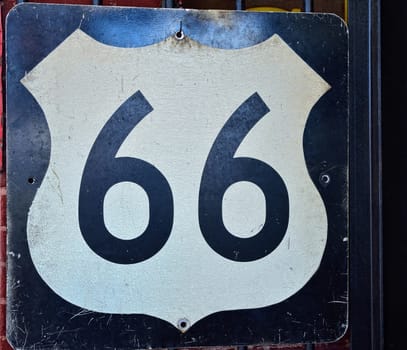Historic old Route 66 black sign.