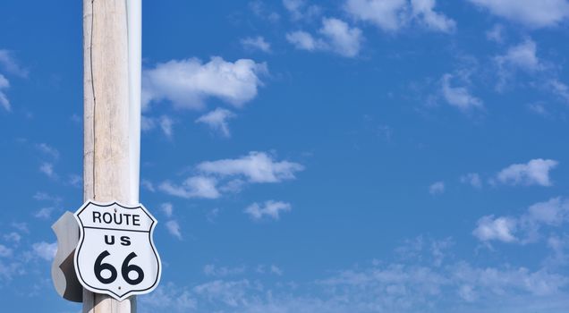 Route 66 sign on blue sky background