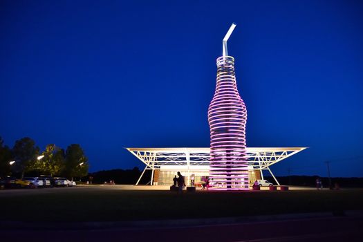 Arcadia, Oklahoma - July 19, 2017: Drive down historic route 66 through Arcadia, Oklahoma, and you canÕt miss the neon, 66-foot-tall soda bottle in front of POPS. The biggest bottle of soda in the world