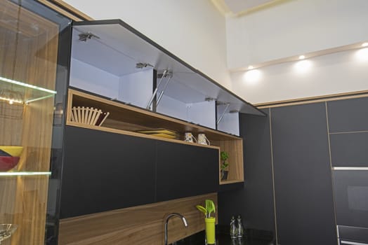 Interior design decor showing modern kitchen with cupboards in luxury apartment showroom