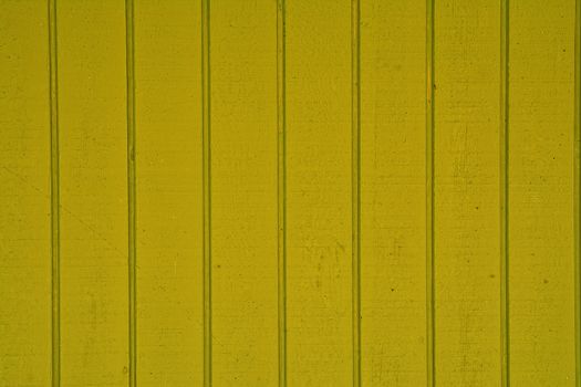 Close-up of vertical wooden planks of yellow color