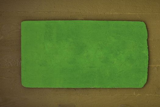 A rustic wooden sign in green and brown, color copy space.