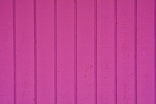 Close-up of vertical wooden planks of pink color