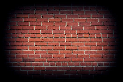 Red brick wall texture background with vignetting corners