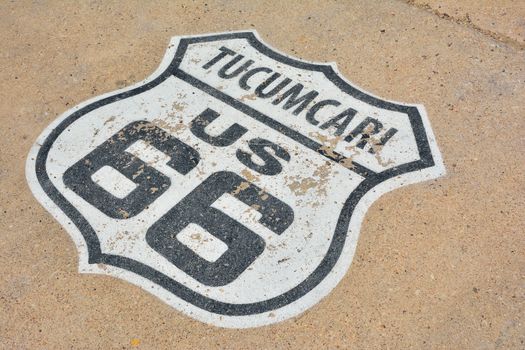 Route 66 sign painted on the road in Tucumcari