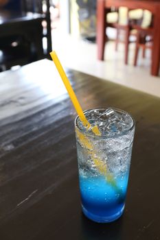 Glass cool ice water blue lemon juice on table for drink fresh