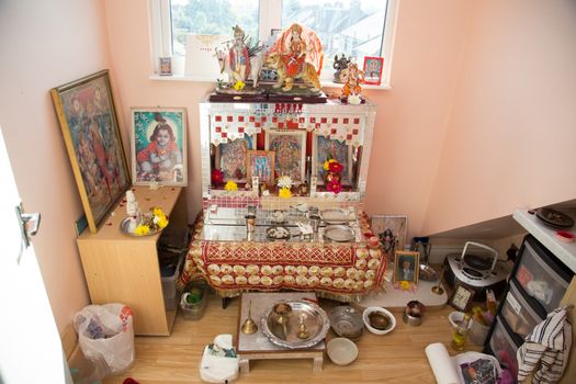 Religious items in the corner of an Indian household