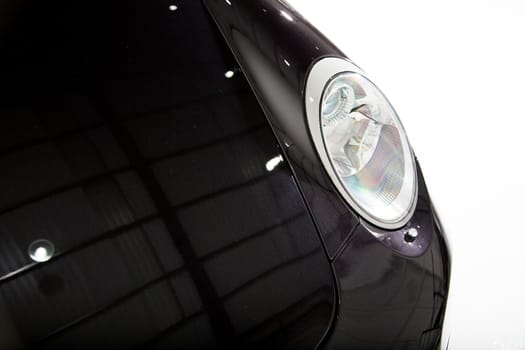 Front headlight of black car