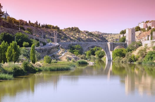 Sunrise view Alcantara bridge in Toledo, Spain.