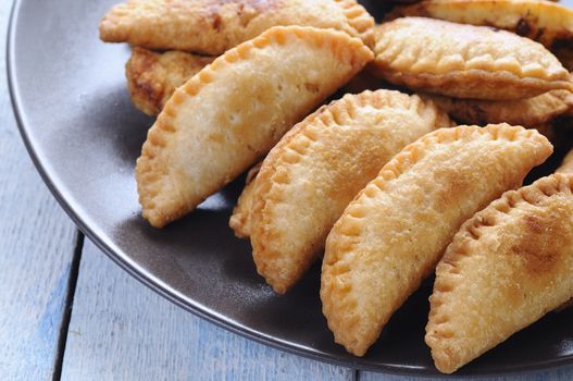 Close-up of crusty dumplings on plate