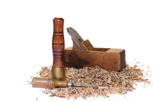 Wood tools and chips on white background.