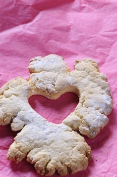 Baked heart on pink baking paper