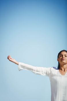 Calm brunette doing yoga in a sunny day