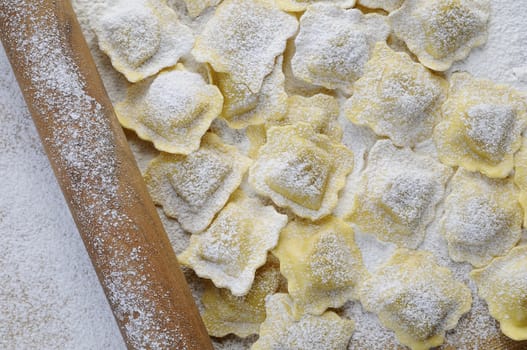 Preparing fresh ravioli at the kitchen table.