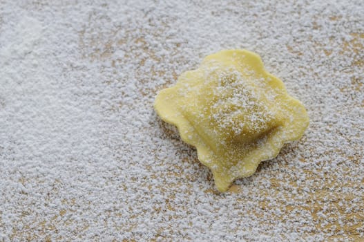 Preparing fresh ravioli at the kitchen table.