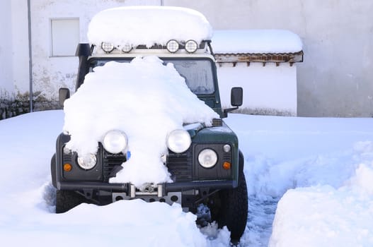 All-terrain vehicle covered with snow outdoors