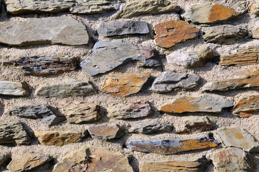Sharp stone wall in sunlight