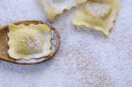 Preparing fresh ravioli at the kitchen table.