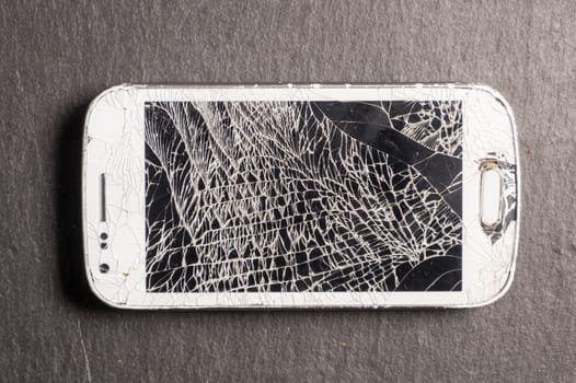 Broken phone isolated very deteriorated