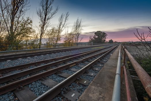 railway crossing sunset