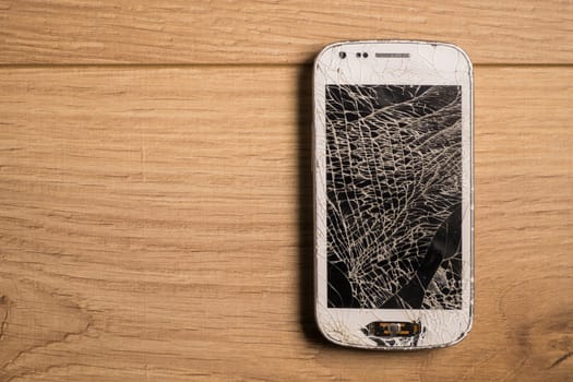 Broken phone isolated very deteriorated
