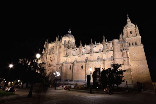 Building exterior of beautiful ancient cathedral in Spain at night time