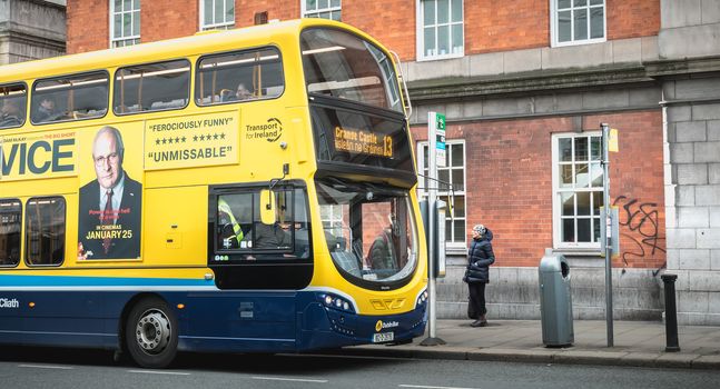 Dublin, Ireland - February 11, 2019: Typical bus traveling down Dublin Street on a winter day