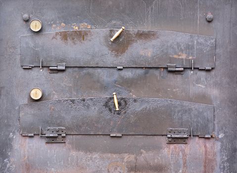 Close-up of closed aged iron pizza oven