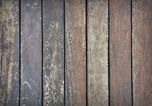 Close-up of vertical weathered wooden planks.