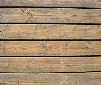 Close-up of vertical weathered wooden planks.