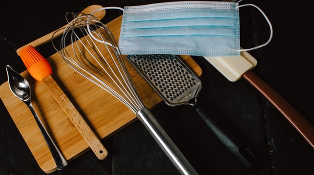 kitchen utensils and tools. Face mask in modern kitchen.