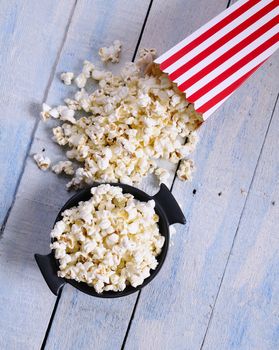 Freshly made popcorn on a wooden table