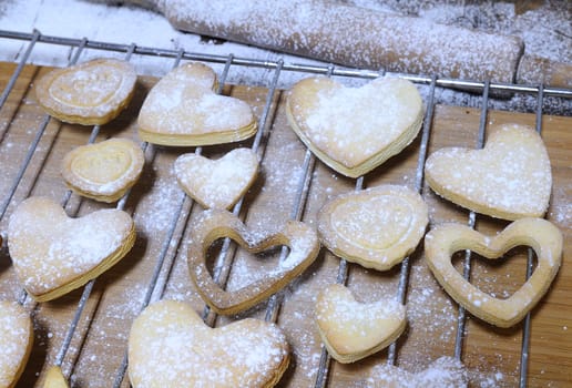 Homemade cookies for valentines day over wooden table