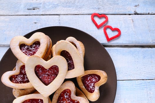 Homemade cookies for valentines day over wooden table