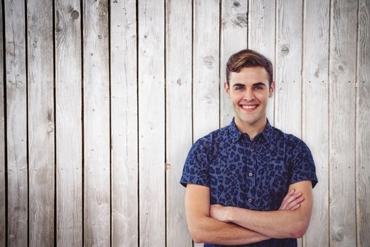 Handsome man against wooden planks