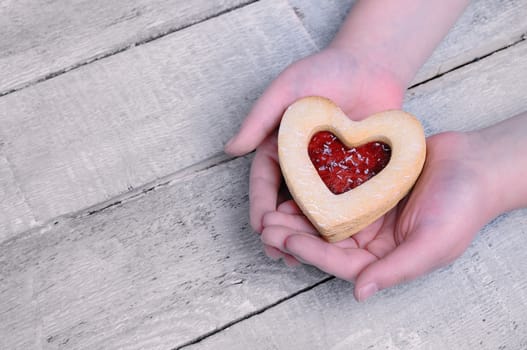 Homemade cookies for valentines day over wooden table