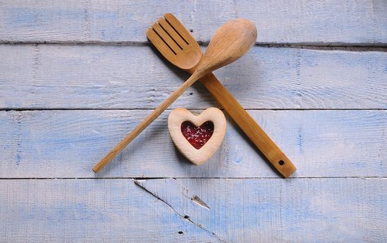 Homemade cookies for valentines day over wooden table