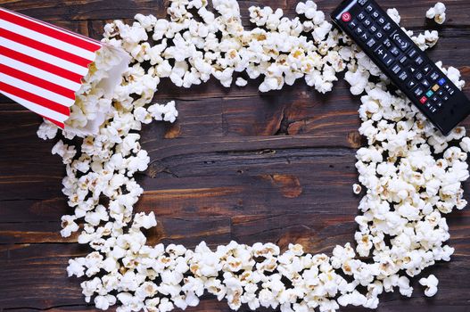 Freshly made popcorn on a wooden table