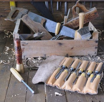 Old toolbox on the workbench in a carpentry