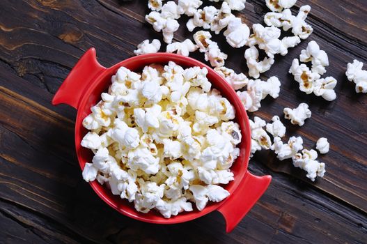 Freshly made popcorn on a wooden table