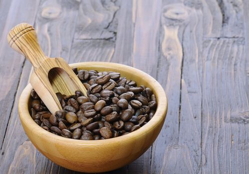 Coffee beans of the highest quality on the wooden table.